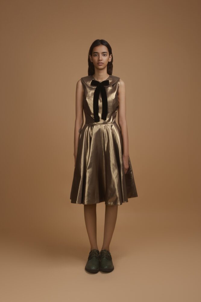 Gold Peter Pan Dress With A Black Bow